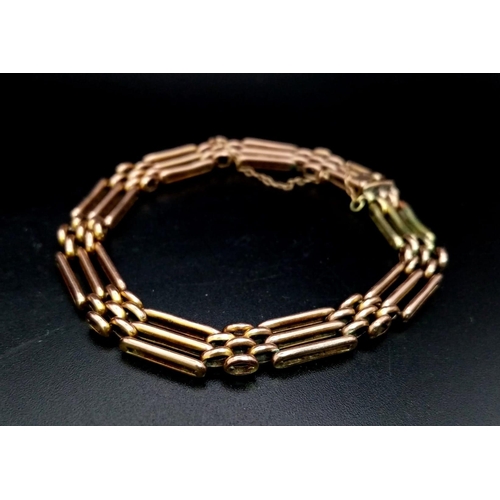 1434 - A Vintage 9K Gold Gate Bracelet with Safety Chain. 18cm. 10.56g