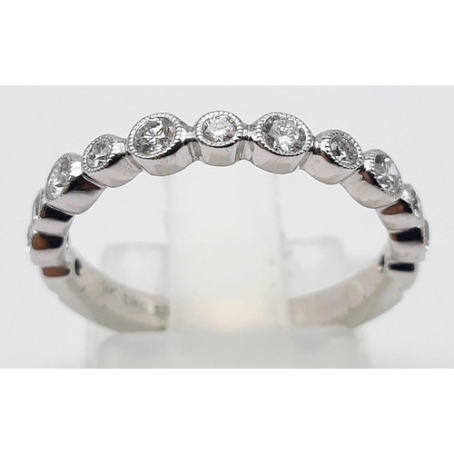 1459 - A 9K WHITE GOLD AND DIAMONDS HALF ETERNITY RING .  2.2gms   size M