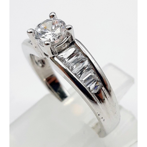 1463 - A 9K WHITE GOLD RING WITH SPARKLING ZIRCONIA STONES .4.1gms   size K/L