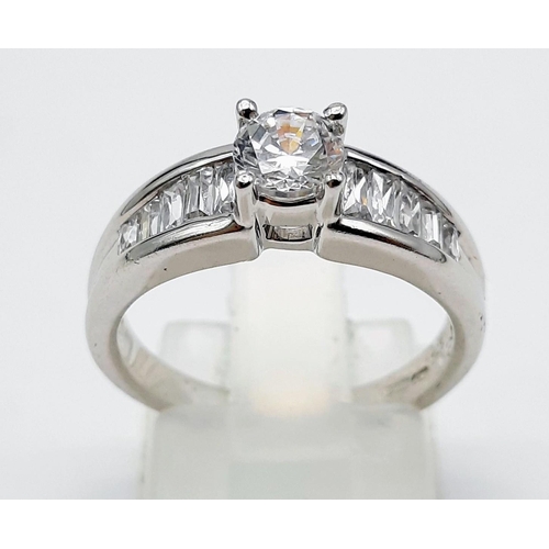 1463 - A 9K WHITE GOLD RING WITH SPARKLING ZIRCONIA STONES .4.1gms   size K/L