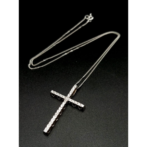 1411 - A 14k White Gold and Diamond (27 stones) Cross Pendant on an 18K White Gold Disappearing Necklace. 3... 