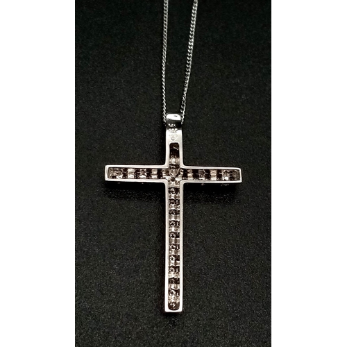 1411 - A 14k White Gold and Diamond (27 stones) Cross Pendant on an 18K White Gold Disappearing Necklace. 3... 