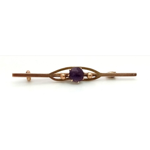 1475 - An Antique Victorian 9K Rose Gold and Amethyst Bar Brooch. 
5cm. 1.89g total weight.