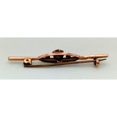 1475 - An Antique Victorian 9K Rose Gold and Amethyst Bar Brooch. 
5cm. 1.89g total weight.