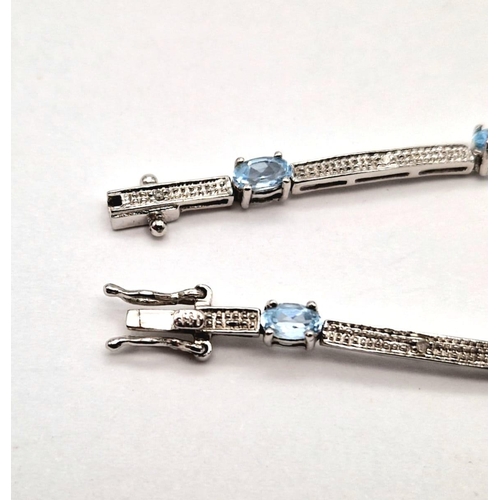 1462 - A 9K WHITE GOLD VERY PRETTY AQUA MARINE BRACELET.  5,9gms   19cms