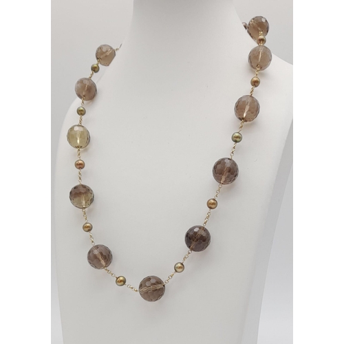 1343 - 9K Gold and Smokey Quartz Necklace. 61grams. 58cm in length.