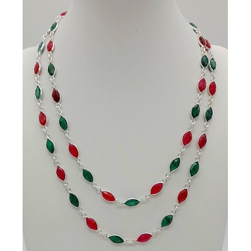 1430 - 925 Silver, emerald and Ruby Long Chain, Approx 80cm length and with a total weight 20grams.