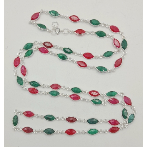 1430 - 925 Silver, emerald and Ruby Long Chain, Approx 80cm length and with a total weight 20grams.