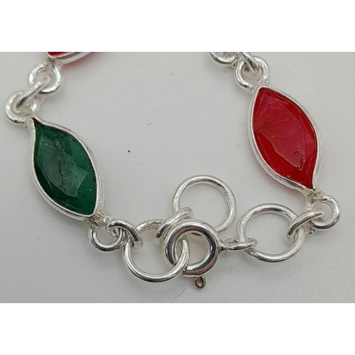 1430 - 925 Silver, emerald and Ruby Long Chain, Approx 80cm length and with a total weight 20grams.