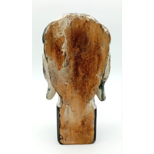 1084 - AN EXREMELY OLD HAND CARVED WOODEN BUDDHIST HEAD WITH FLAT BACK.  22 X 12cms