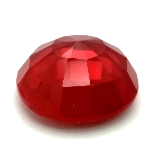 111 - A show stopping, large (63 carats) RUBY. Round cut, with a vivid pigeon blood red colour, excellent ... 