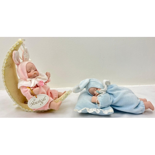 1122 - A Pair of Musical Porcelain Baby Dolls, Both are manual winders and play a relaxing Twinkle Twinkle ... 