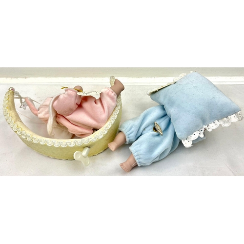 1122 - A Pair of Musical Porcelain Baby Dolls, Both are manual winders and play a relaxing Twinkle Twinkle ... 