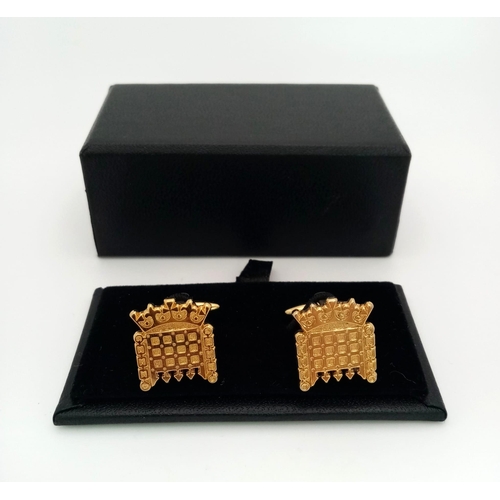 279 - For the one with political aspirations: A pair of cufflinks with the House of Parliament logo. In a ... 