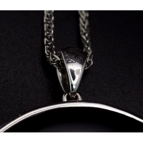 321 - AN 18K WHITE GOLD STAR OF DAVID DIAMOND PENDANT WITH BLACK ONYX ON A 18K GOLD 42cms CHAIN.