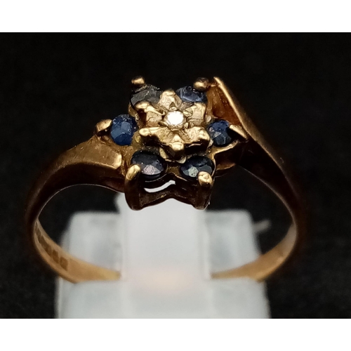 613 - An Antique 9K Gold Sapphire and Diamond Ring. Six old cut sapphires and a small diamond. Size P. 2.0... 