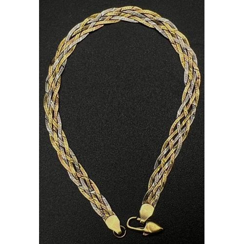 74 - A 9K Three Gold Coloured Flat Braid Link Bracelet. 18cm. 2.69g.