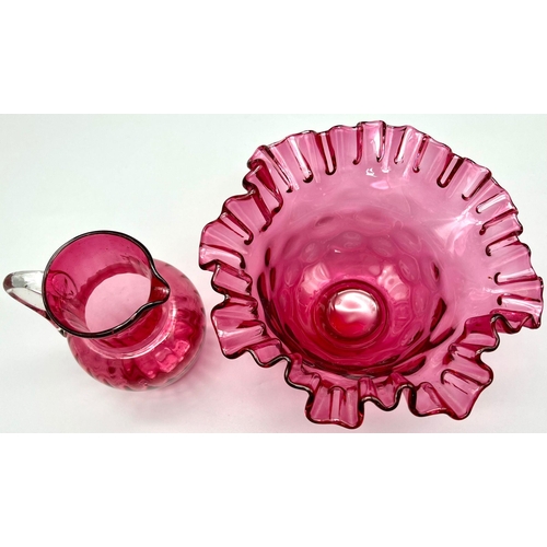 1108 - A Cranberry Glass Dish, 10cm tall and 19cm diameter And a Cranberry Glass Small Jug, 12cm in Height,... 