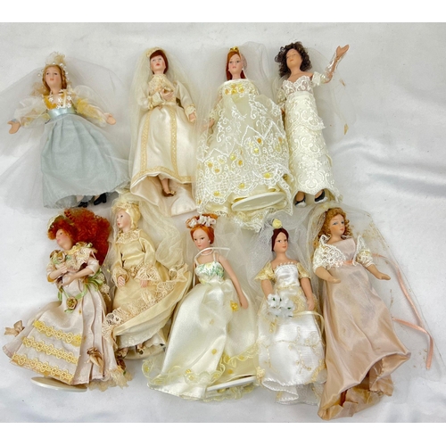 1239 - A Collection Of 9 Dolls in wedding Dresses, all 19cm including the tiara and stand.