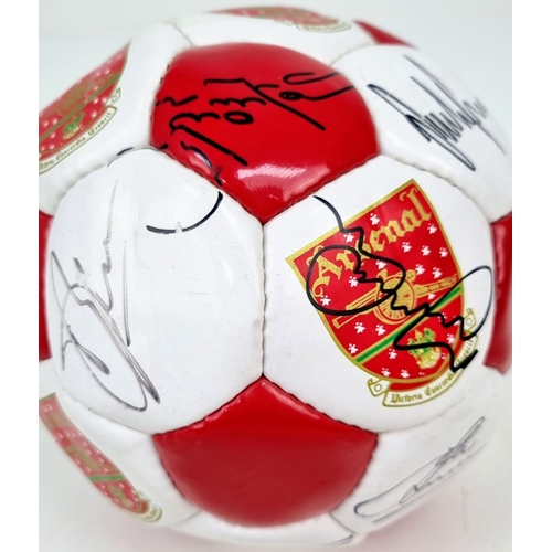 1093 - An Arsenal FC 1999-2000 Signed Football. Signatures include Bergkamp, Adams, Keown, Dixon and Silvin... 