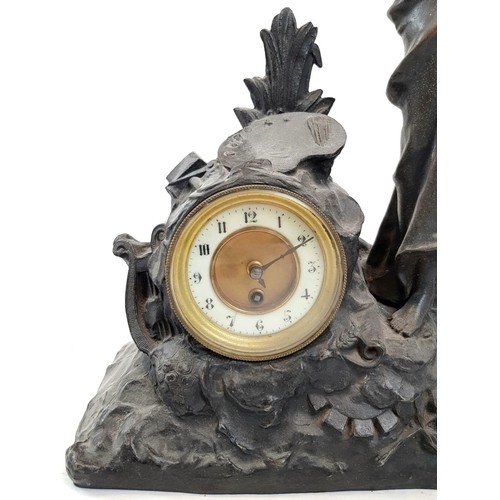 1301 - An Antique Spelter Mantle Clock Decorated with a Woman Blowing Her Own Horn - In favour of Dickens, ... 