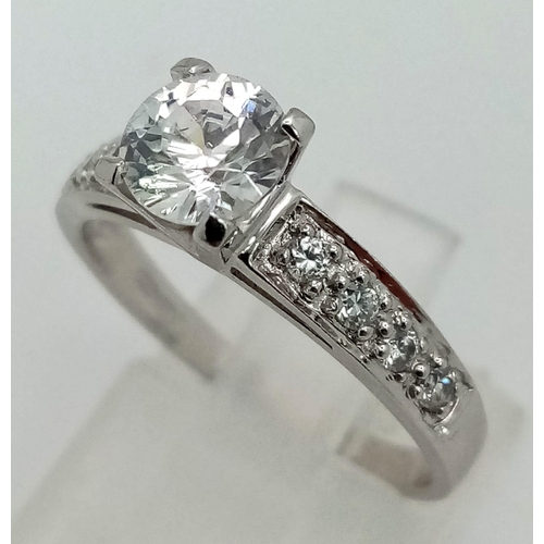 1275 - 9k White Gold CZ Ring. Total Weight 2.6grams. Size O.