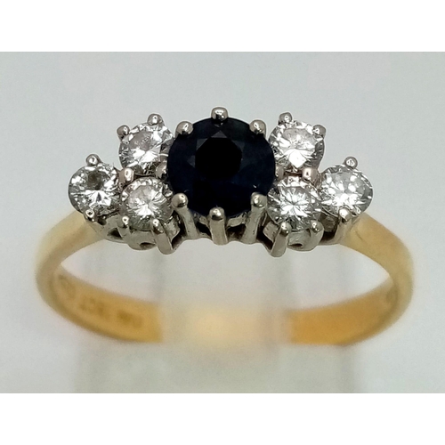 1279 - 18k Gold Diamond and Blue Sapphire Ring. Total Weight 3.27grams. Size O.