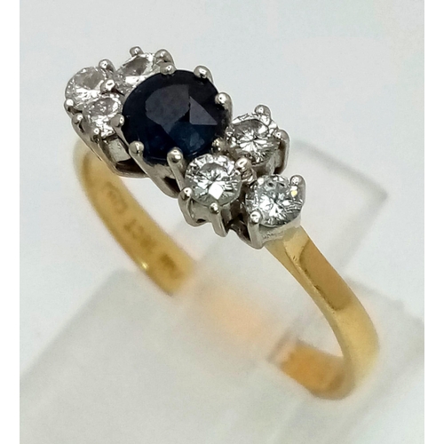 1279 - 18k Gold Diamond and Blue Sapphire Ring. Total Weight 3.27grams. Size O.