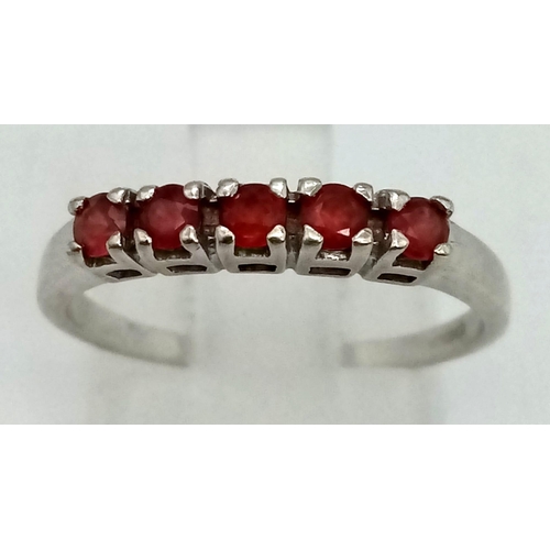 1308 - A 9K White Gold Garnet Ring. Size N. 1.83g