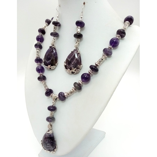 139 - A beautiful amethyst and Tibetan silver necklace and earrings set with large tear-drop pendants. Nec... 