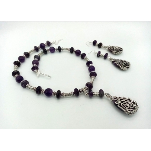 139 - A beautiful amethyst and Tibetan silver necklace and earrings set with large tear-drop pendants. Nec... 