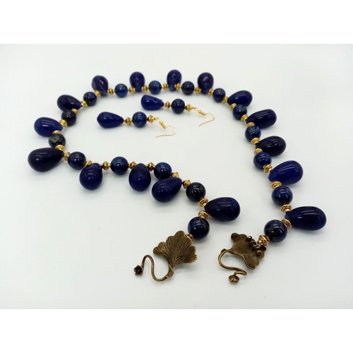 188 - An Art Nouveau lapis lazuli necklace and earrings set. Necklace length: 57 cm, earrings length: 6 cm... 