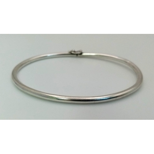 228 - A 950 Platinum Bangle, With Safety lock clasp. Weighs 6.69grams.