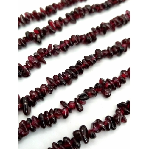 286 - A very feminine four strand garnet necklace. Length: 47-57 cm, weight: 130 g.