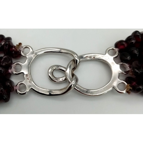 286 - A very feminine four strand garnet necklace. Length: 47-57 cm, weight: 130 g.