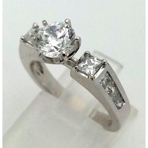 414 - A fabulous 9K white ring with cubic zirconia. Ring size: M1/2, weight: 4.54 g.