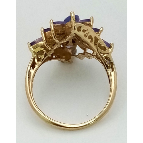 681 - A 9K Yellow Gold Amethyst Floral-Design Ring. Size J/K.
3.03g total weight.