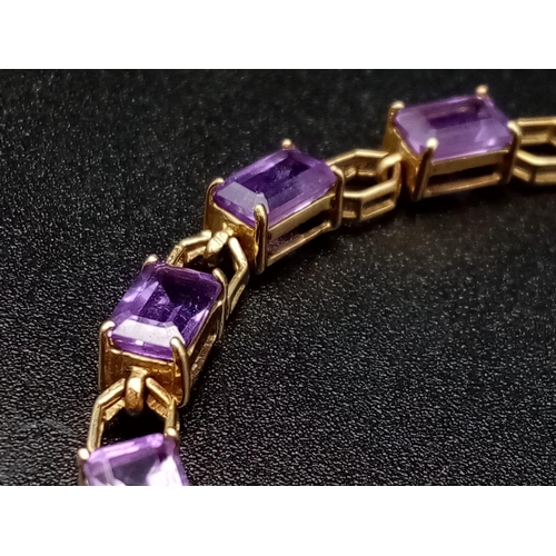 69 - A Vintage 9K Gold Amethyst Tennis Bracelet. 18cm. 7.83g total weight.