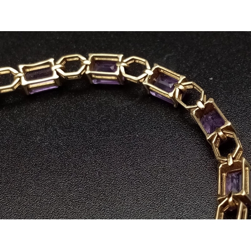 69 - A Vintage 9K Gold Amethyst Tennis Bracelet. 18cm. 7.83g total weight.