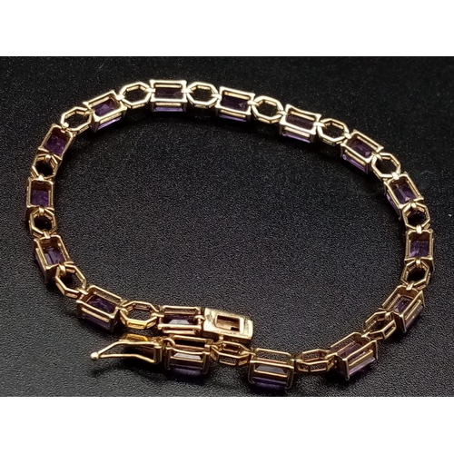 69 - A Vintage 9K Gold Amethyst Tennis Bracelet. 18cm. 7.83g total weight.