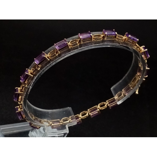 69 - A Vintage 9K Gold Amethyst Tennis Bracelet. 18cm. 7.83g total weight.