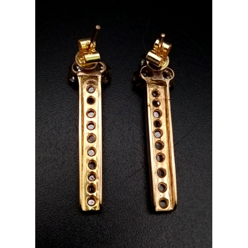 1263 - 18k Rose Gold Diamond Dangler Earrings. 1ct Diamond.  Total Weight 5.08grams