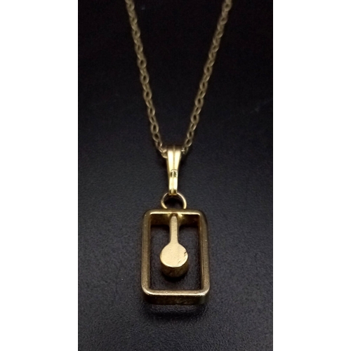 589 - A 9K Yellow Gold White Stone Pendant on a 9K Yellow Gold Necklace. 2cm and 38cm. 1.62g total weight.