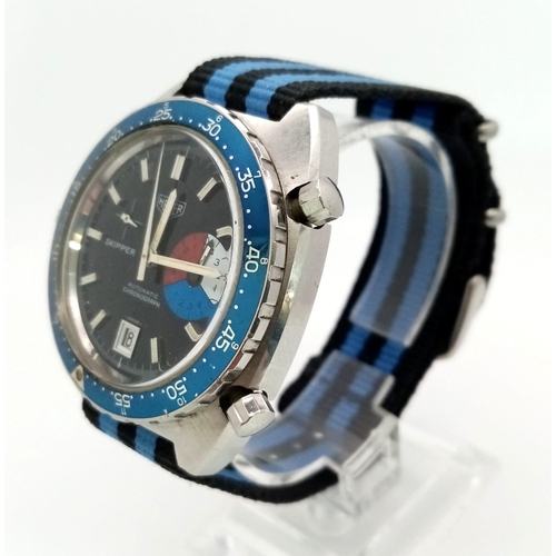 113 - A HEUER SKIPPER gents watch. 42 mm case, blue bezel, dark blue face with white hands and hour marks.... 