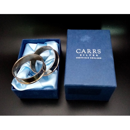 1229 - Two Carrs of Sheffield Sterling Silver Napkin Rings. Comes in a Carrs presentation case. 28g total w... 