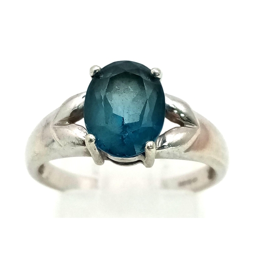 1309 - A 9K White Gold Blue Topaz Ring. Size N. 3.07g total weight.