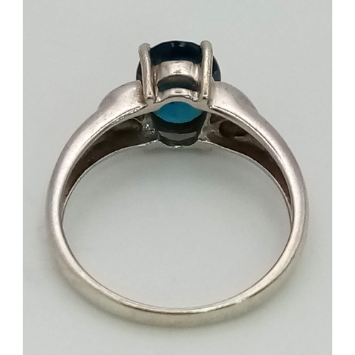 1309 - A 9K White Gold Blue Topaz Ring. Size N. 3.07g total weight.