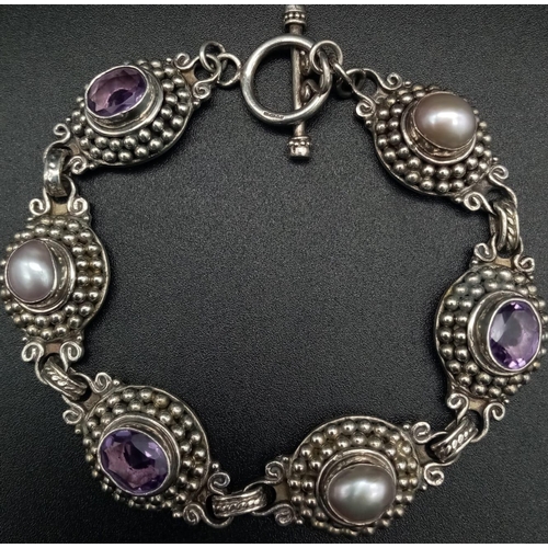 1338 - A Vintage Amethyst and Pearl Bracelet. Each piece sits in a nest of tiny balls. 22cm. 36.45g total w... 