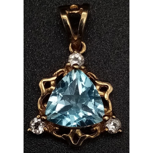 1409 - A 9K Yellow Gold Blue and White Stone Pendant. 25mm. 2.45g total weight.