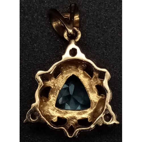 1409 - A 9K Yellow Gold Blue and White Stone Pendant. 25mm. 2.45g total weight.